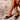 Sandalia plana negra Pink Desert para mujer, vista frontal con detalle metálico - © Calzados Modesto®