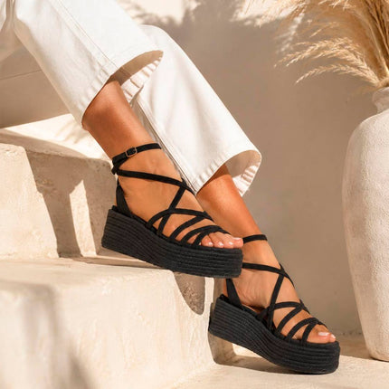 Sandalias de plataforma negras Pink Desert mujer, vista lateral detalle de suela esparto y cierre te - © Calzados Modesto®