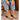 Mujer con vaqueros puestos y botines de tacón Bubble Bobble color taupe - © Calzados Modesto®