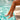 Adidas Adilette Shower Oro mujer con pies en agua, detalle de tobillo - © Calzados Modesto®