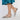 Bailarinas Gioseppo plateadas mujer MDLT71180 combinadas con falda azul, mostrando diseño cruzado y calado - © Calzados Modesto®