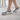 Zapatillas deportivas XTI grises de mujer, estilo casual, con cordones blancos y detalles a rayas - © Calzados Modesto®